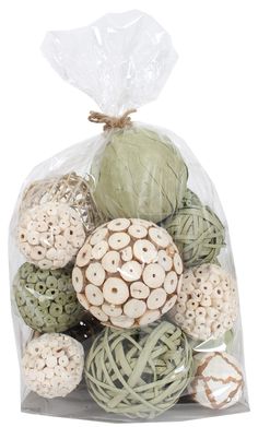 a bag filled with lots of different types of yarn and buttons on top of each other