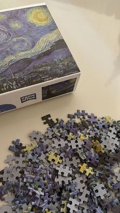 the puzzle box is filled with pieces of starry night art, and it's missing one piece