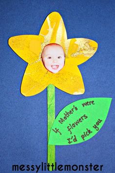 a paper flower with a child's face on it