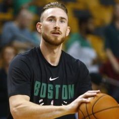 a man holding a basketball in his right hand