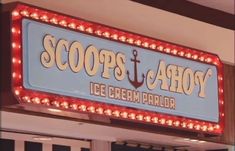 a sign that says scoops & ahoy ice cream parlor