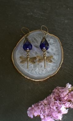 Earrings from the Art Nouveau style, bronze dragonflies dangle from cobalt blue crystal drops.  They are perfect for a special occasion or for everyday wear with a beautiful blouse. All my pieces are handmade with great care and dedication. I carefully choose the materials to create beautiful and magical accessories. If you have any questions about the product, just ask.  Care instructions: -Don't wear jewelry while in the shower, beach, or pool. -Don't use it while sweating. -Keep jewelry away Dragonflies Art, Dragonfly Art Nouveau, Long Turquoise Earrings, Art Nouveau Earrings, White Flower Earring, Art Nouveau Earring, Magical Accessories, Blue Dragonfly, Dragonfly Earrings