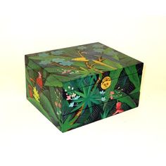 a green box with flowers and birds painted on it