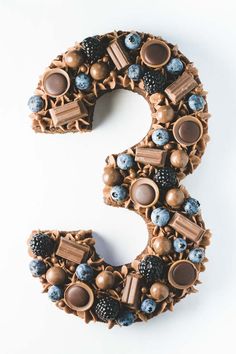 the number 3 made out of chocolate and blueberries