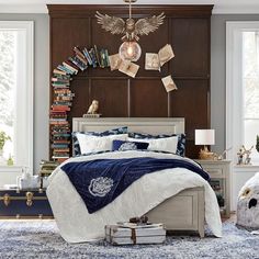 a bedroom with a large bed and lots of books