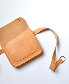 Brown Crossbody Belt Bag With Removable Belt, Classic Brown Bag With Belt Detail, Classic Brown Belted Bag, Everyday Pouch Shoulder Bag With Belt Detail, Brown Bags With Belt For Everyday Use, Everyday Belted Pouch Shoulder Bag, Brown Pouch Belt Bag With Removable Belt, Brown Pouch Shoulder Bag With Removable Belt, Brown Rectangular Shoulder Bag With Removable Belt