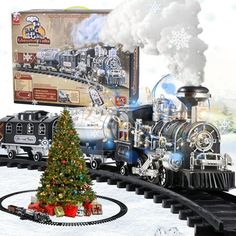 a toy train set with a christmas tree on the track and an advertisement for it