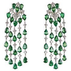 Earrings White Gold 18 K Gianni Lazzaro (Matching Rind Available) Diamonds 42-2,79 ct HSI Tsavorite 42-18,30 ct. With a heritage of ancient fine Swiss jewelry traditions, NATKINA is a Geneva-based jewelry brand that creates modern jewelry masterpieces suitable for everyday life. It is our honor to create fine jewelry, and it’s for that reason that we choose to only work with high-quality, enduring materials that can almost immediately turn into family heirlooms. From our selection of precious me Italian Coast, Diamond Chandelier Earrings, Diamond Chandelier, Studded Earrings, Pear Earrings, Earrings White Gold, White Gold Diamond Earrings, Sapphire Necklace Pendants, Gold Diamond Earrings