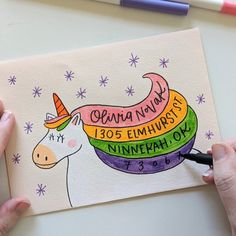 someone is drawing a unicorn with colored pencils