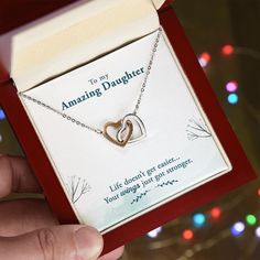 To My Amazing Daughter, Life doesn't get easier, your wings got stronger. Give her the gift that symbolizes your never-ending love. Featuring two lovely hearts embellished with cubic zirconia crystals, this Interlocking Hearts necklace is the perfect accessory for everyday wear. Whether it's a memorable anniversary or a special birthday, make sure to dazzle your special someone by gifting them this stunning necklace. Two heart pendants embellished with CZ crystals High quality polished surgical Rose Gold Double Heart Necklace Gift, Double Heart Necklace Gift With Hallmark, Double Heart Necklace Hallmark Gift, Double Heart Necklace As Gift With Hallmark, My Amazing Daughter, Amazing Daughter, Interlocking Hearts, Get Stronger, Hearts Necklace