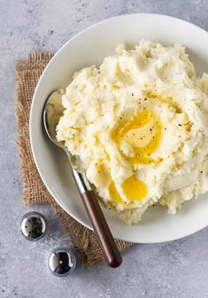 mashed potatoes with butter and olive oil in a white bowl