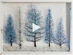 a painting with trees painted on it in blue and white colors, the video is being displayed