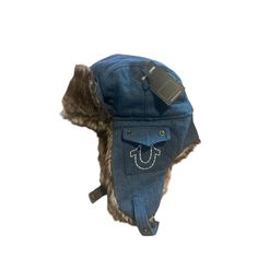 Stay Warm And Stylish This Winter With This True Religion Trapper Hat. The Faux Fur And Cotton Material Will Keep You Cozy, While The Denim Fabric Type Adds A Touch Of Classic Style. The Solid Pattern And Blue Color Make It A Versatile Accessory For Any Casual Occasion. This One Size Fits All Hat Features Lined Ear Flaps And Insulation, Making It Perfect For Outdoor Activities During The Winter Season. The Horseshoe Pockets Add A Unique Touch To The Design, Making It A Must-Have For Any Designer Trapper Hat Pattern, Fur Trapper Hat, Denim Cap, Trapper Hat, Trapper Hats, Fur Hat, Lucky Girl, Solid Pattern, Denim Fabric