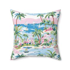 a pink and blue pillow with palm trees on the beach, boats in the water