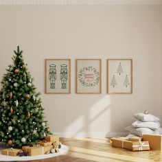 a christmas tree in the corner of a room with presents under it and three framed pictures on the wall