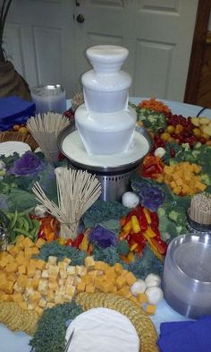 a table topped with lots of different types of food and condiments on top of it