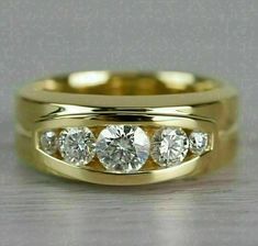 three stone gold wedding ring set with diamonds