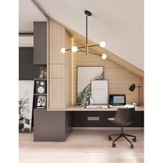 a desk with a laptop on it under a slanted ceiling in an attic office