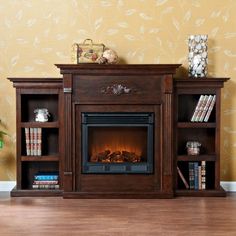 a living room with a fire place and bookshelves