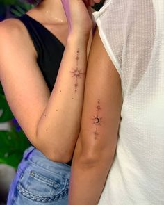 a woman with a star tattoo on her arm