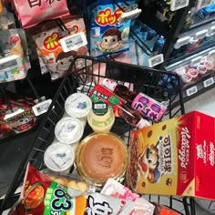 a shopping cart filled with food and snacks