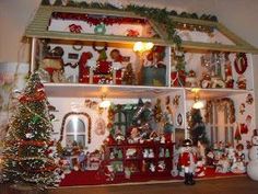 a doll house is decorated with christmas decorations