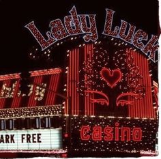 the lady luck casino sign is lit up for valentine's day with red and white lights