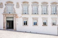 an old building with many windows and doors