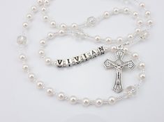 - Personalized rosary beads for a baptism, confirmation, or first communion. Beautiful Catholic wedding bridal keepsake. Suitable for all ages. - Customize with name or initials, choose your crucifix and medals. - Gift box and pouch included. - Get it FAST! Rush options available at checkout - message me with your zip and I'll look up more accurate estimated delivery dates.    This white handmade baptism rosary is made with white Czech glass pearls and crystals and big antique looking Czech cathedral beads. It has a beautiful vintage look. Comes with your choice of Baptism, First Communion, Confirmation, or other medals. Suitable for all ages - babies, children, teenagers, women. It makes a meaningful gift for a birthday, anniversary, wedding, bridal shower, Christmas, etc. Over 80 colorfu White Rosary With Round Beads For Confirmation, White Spiritual Rosary For Baptism, Personalized Silver Rosary For First Communion, Adjustable White Rosary For First Communion, Personalized Rosary With Round Beads For Wedding, Personalized White Rosary For Confirmation, Personalized Silver Rosary For Confirmation, Beaded Cross Rosary For First Communion, White Rosary With Round Beads For First Communion