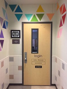 a door with the name login on it in front of some colorful wallpaper