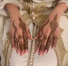 a woman with henna on her hands