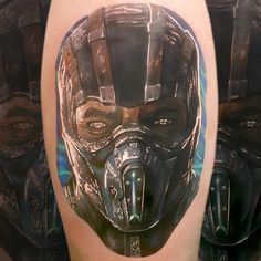 a close up of a person wearing a mask on their arm with other people in the background