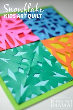 the snowflake kids art quilt is made with construction paper and colored construction paper