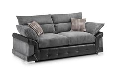 a black and grey couch with two pillows on the armrests, sitting against a white background