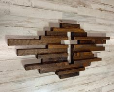 a wooden wall sculpture made out of wood planks