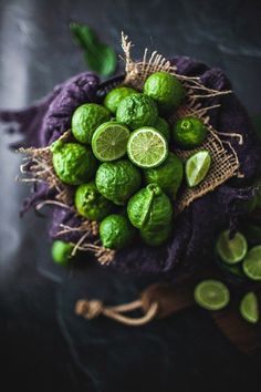 the limes are arranged on top of the cloth