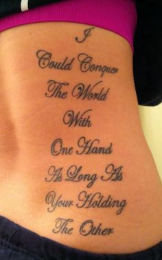 the back of a woman's stomach with an inscription on it that says i could conquer the world with one hand as long as your holding the other