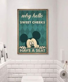 a bathroom with a toilet and a poster on the wall above it that says, why hello sweet cheeks have a seat