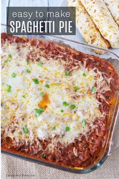 easy to make spaghetti pie recipe in a casserole dish with cheese and parmesan