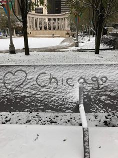 the sidewalk is covered in snow and has writing on it that says, go chicago