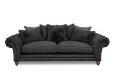 a black couch with pillows on it