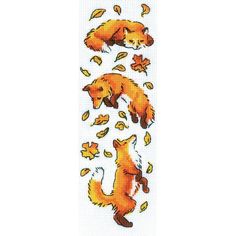 the cross stitch pattern shows two foxes in autumn leaves, and one is falling down