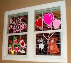 three windows decorated with valentine's day decorations