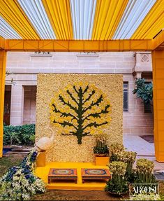 an outdoor area with yellow and white decorations