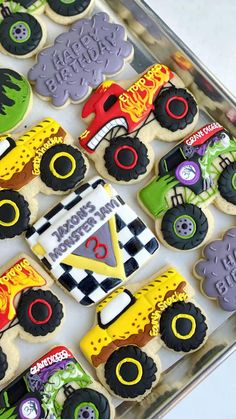 decorated cookies in the shape of monster trucks