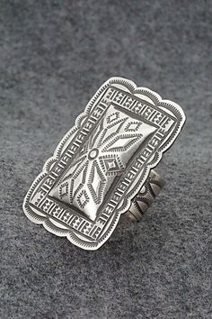 This stunning sterling silver ring was made by Navajo silversmith Leander Tahe. The inside of the band is signed L Tahe and stamped sterling.Size: 8 AdjustableLength: 2 1/8"Width: 1 1/2"Free shipping on all orders! We ship with USPS and always include tracking. All orders ship within a day of payment.Returns are accepted up to 30 days after you receive your order. Just send us a message. Our shop offers cash back or store credit. The item must be returned in new condition. Silver Western Rings, Western Rings, Zuni Jewelry, Turquoise Jewelry Native American, Southwest Jewelry, American Southwest, Cowgirl Western, Silver Work, Western Jewelry