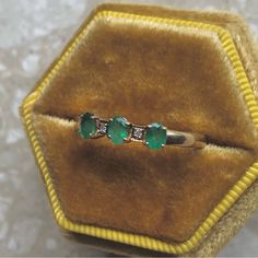 Three Oval Emeralds Set In 9k Yellow Gold (Hallmarked) With Diamond Accents. Size 9.5 - Can Be Resized By Any Jeweler Ring Weighs 2 Grams Ring Face 13mm X 4mm Excellent Vintage Condition Gold Box Sold Separate Modern / Mid Century / Victorian Mid Century Victorian, Gold Vintage Ring, Gold Box, Vintage Ring, Oval Diamond, Womens Jewelry Rings, Solitaire Ring, Green And Gold, Vintage Rings