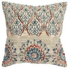 a decorative pillow with an intricate design on the front and back, made from cotton