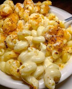 a white plate topped with macaroni and cheese