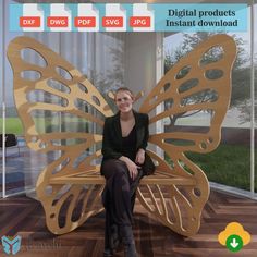 a woman sitting on top of a wooden butterfly